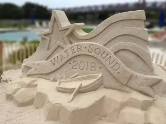water sound logo made out of sand