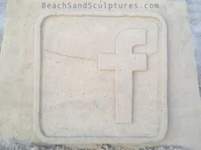 facebook logo sand sculpture